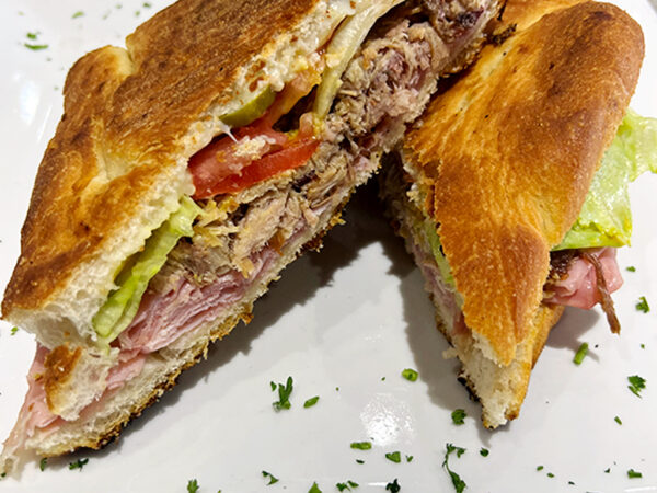 Cuban Sandwich. Focaccia bread with Parmacotto, roasted pork, swiss, pickles, lettuce, tomato, mustard - Image 2